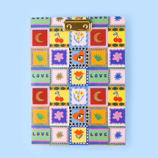 Colourful patchwork-style clipboard with various symbols and 'LOVE' text on a blue background