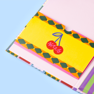 Colourful padfolio inner wallet with a cherry design on a blue background