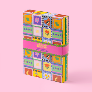 Colourful keepsake notebooks box with patchwork design on a pink background