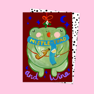 Card with a green toad wearing a 'Mistle-toad and Wine' scarf under mistletoe.