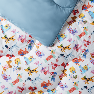 Children's bedding set with colourful animal patterns on a white background