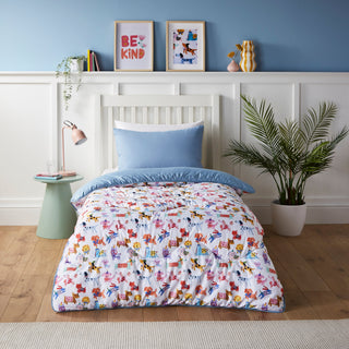 Kids bedroom with colourful bedding, plant, and wall decorations.