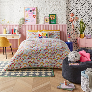 Bedroom with colourful bedding, accessories, and décor.
